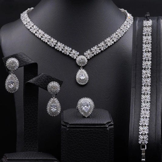 Jewelry set with snowflake pendants and cubic zirconia.