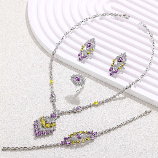 Cubic zirconia jewelry set with purple pendant.